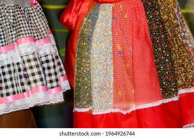 Printed And Very Colorful Round Skirts During Dance At Festa Junina Or June Party Translated Into English. Blur Background.