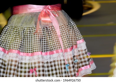 Printed And Very Colorful Round Skirts During Dance At Festa Junina Or June Party Translated Into English. Blur Background.