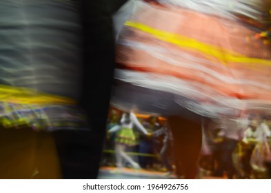 Printed And Very Colorful Round Skirts During Dance At Festa Junina Or June Party Translated Into English. Blur Background.