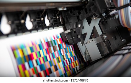Printer ink jet print machine printing color patches for color management control - Shutterstock ID 1371448976