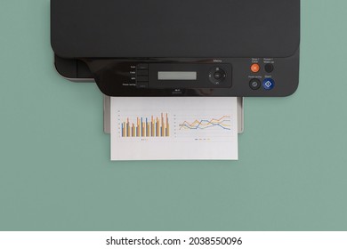 Printer on green background. Top view with copy space. Flat lay.