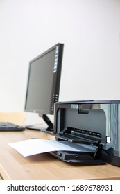 Printer On The Wooden Desk And A4 Paper Desktop Computer System