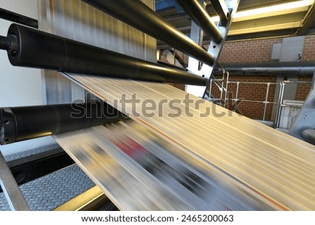 printing of coloured newspapers with an offset printing machine at a printing press company