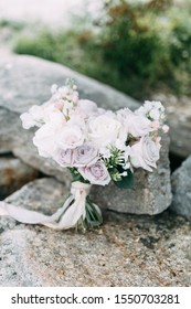 Printing And Decor For A Wedding With Flowers. Modern Bridal Bouquet In Hand. 