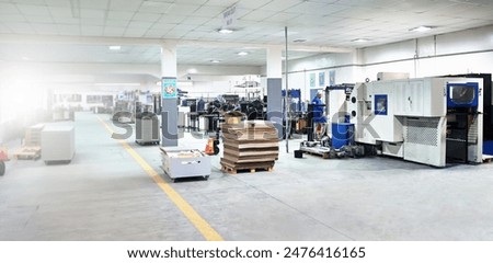 Printing, factory and manufacturing in warehouse at production facility, distribution and storage plant. Workshop, business and service process or newspaper industry with supplier or wholesale stock