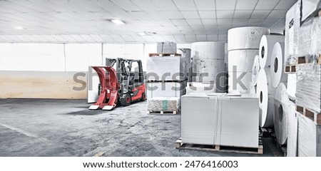Printing, factory and paper manufacturing in warehouse at production facility, distribution and storage. Workshop, business and service process or newspaper industry with supplier or wholesale stock