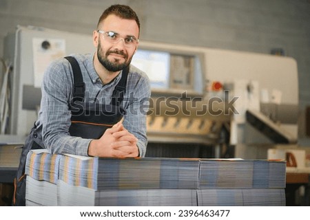 printing house, experimented technician works on UV printer. Production work. Stock photo © 