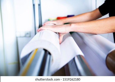Printing house, service of the printing process. Printing plotter support, the printer operates the machine - Shutterstock ID 1519262180