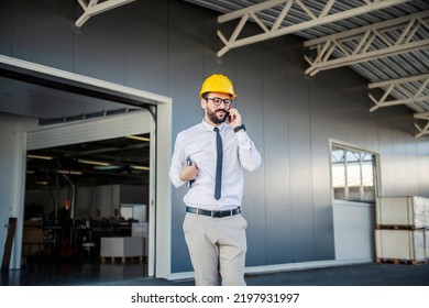 A Printing Shop Manager Talking To A Client On The Phone.