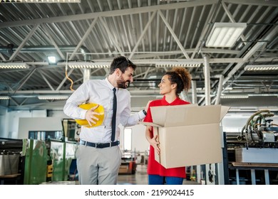 A Printing Shop Worker And Manager Preparing Order For A Customer In A Box.