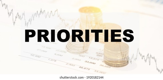 PRIORITIES On Financial Background With Income Chart