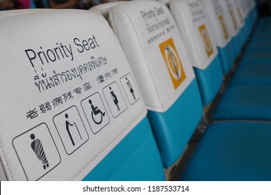 Priority seat for monk, elderly, disabled and pregnant women in The Airport Thailand. with Thai, English and Chinese words. - Shutterstock ID 1187533714