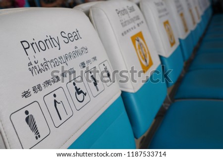 Priority seat for monk, elderly, disabled and pregnant women in The Airport Thailand. with Thai, English and Chinese words.