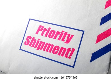 Priority shipment sign on empty letter envelope. 