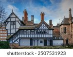 Priory Row Cottages, a historic row of Tudor-style houses located in Coventry, England. These cottages are known for their timber-framed architecture and are a popular tourist attraction.