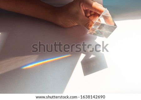 prism dispersing sunlight splitting into a spectrum 