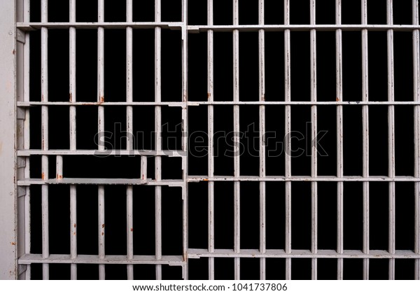Prison cell bars with
black background