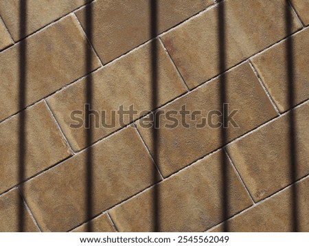 prison jailhouse window bars shadow on tiled floor