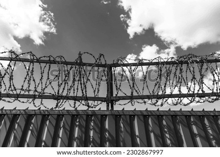 Prison wall with barbed wire. Law. Crime. Jail