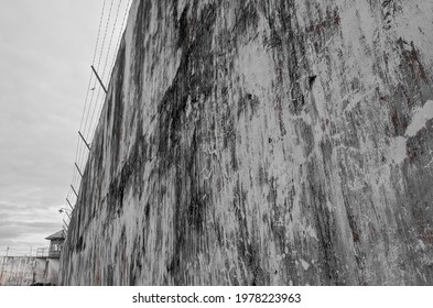 Prison Wall With A Watchtower In The Corner