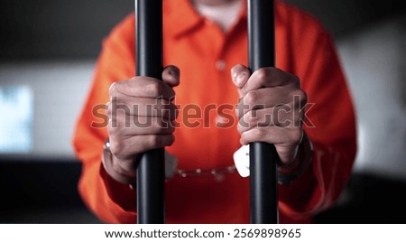 Prisoner Behind Bars In Jail Cell. Crime Punishment And Criminal Justice