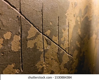 Prisoner counting years with tally marks (hash marks) on the wall.