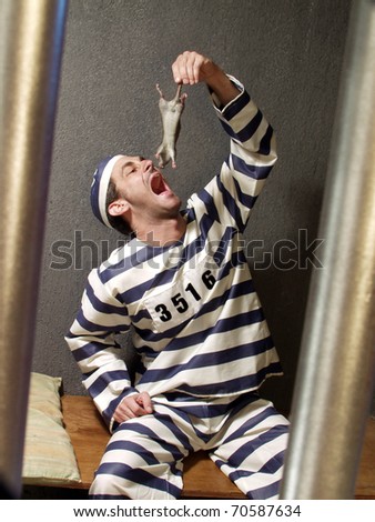 prisoner-eating-rat-on-prison-450w-70587634.jpg