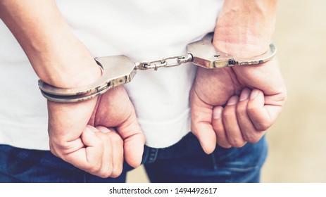 Prisoner male hands criminal with handcuffs - Shutterstock ID 1494492617