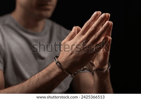 Prisoner male hands criminal with handcuffs.