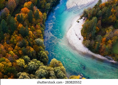 Pristine Alpine Turquoise River Meandering Through Forested Landscape In A Sunny Autumn Day, Aerial View. Pristine, Clean Nature, Pure Water, Environment Concept. 