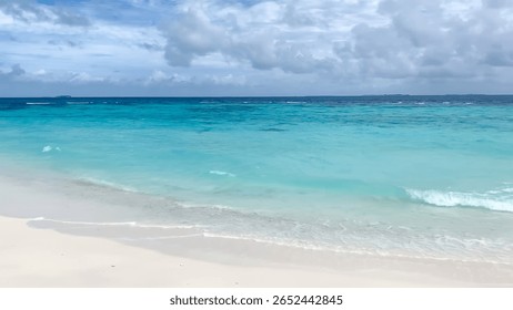 a pristine sandy beach outlined by palm trees and a bright blue ocean under a colorful sky. It evokes a sense of peace and relaxation, ideal for a dream vacation