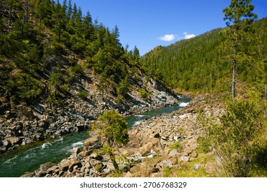 Pristine Smith River running through rugged rocky canyon in Northern California wilderness