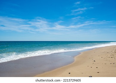 A Pristine Turquoise Blue Ocean And Beach.