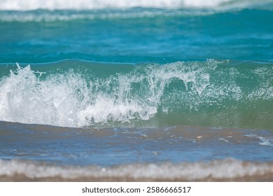 Pristine waves of turquoise waters in the Gulf of Mexico crash along the shores of South Padre Island in south Texas.