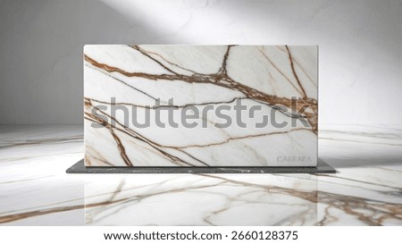 A pristine white marble slab featuring dramatic, flowing golden-brown veining is showcased against a textured grey wall and a highly reflective surface, creating a luxurious and sophisticated display.