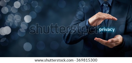 Privacy policy concept. Businessman with protective gesture and text privacy in hands. Wide banner composition with bokeh in background.