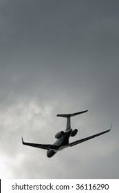 Private Business Jet Taking Off Into A Stormy Gray Sky