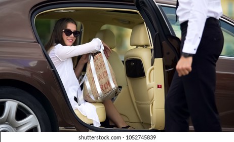 Private Chauffeur Opening Door For Beautiful Female Passenger, Car Services