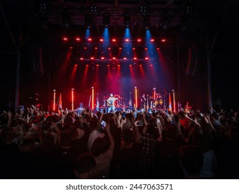 Private concert. Stage with modern singers performance, light beams, stage lighting for an entertainment show. News, Latvia, 03.15.2024 - Powered by Shutterstock