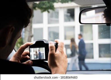Private Detective Spying. Investigation And Surveillance With Camera - Shutterstock ID 1818069683