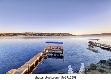 Private Dock Of Waterfront Home With Jet Ski Lifts And Covered Boat Lift, Lake Washington. Top View From The Balcony Of Master Bedroom. Northwest, USA