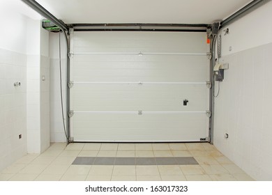 Private Garage Interior With Closed Door From Inside