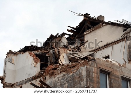 A private house destroyed by a missile strike with broken walls and ceiling