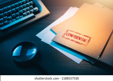 Private investigator desk with confidential envelopes - Shutterstock ID 1188557530