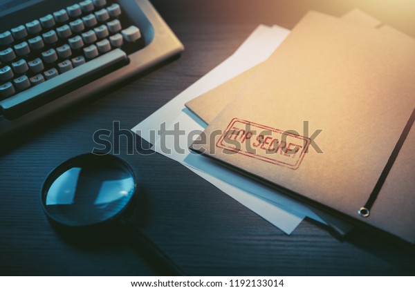Private\
investigator desk with top secret\
envelopes