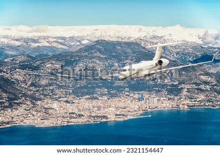 Private jet flying over Monaco
