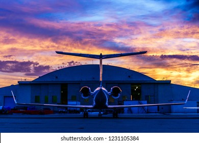 Private Jet In Front Of A Hangar.