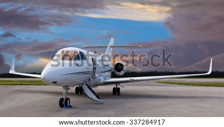 Private jet on the runway with the stair down