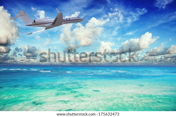 Private Jet Over Tropical Sea Stock Photo (Edit Now) 175632473