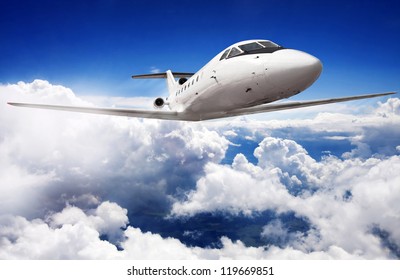 Private Jet Plane In The Blue Sky